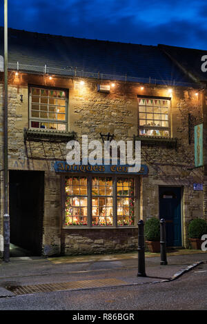 Durham house antiques centre christmas shop window display at night. Stow on the Wold, Cotswolds, Gloucestershire, England Stock Photo