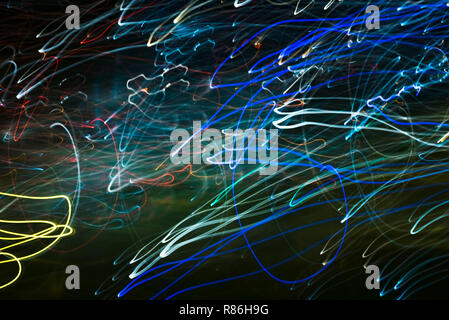 Bright abstract spiral patterns from light strips on a black background Stock Photo