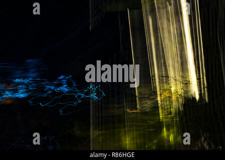 Bright abstract strip patterns from light strips on a black background Stock Photo