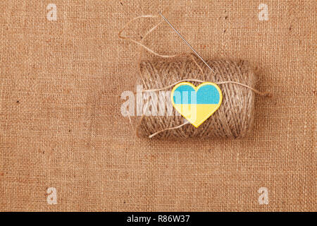 Ball of yarn burlap background Stock Photo