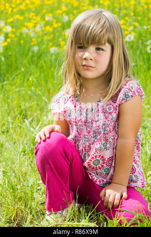 Gril in a spring meadow Stock Photo - Alamy
