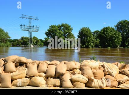 Sandbags on the banks of the Elbe during the flood in Magdeburg Stock Photo