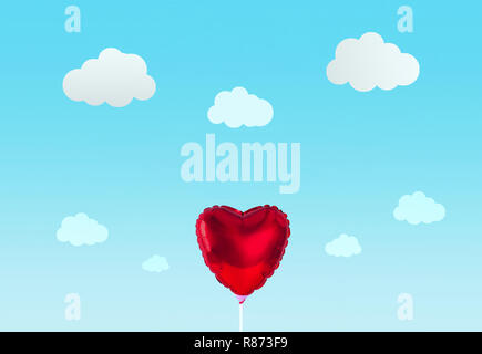 Red heart balloon isolated on blue background. Stock Photo