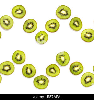 Kiwi fruit slice in zigzig seamless pattern. Colorful food pattern for background. Isolated on white. Top view or flat lay. Stock Photo