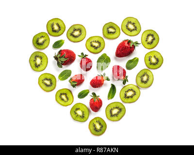 Kiwi thin slices in heart shape with strawberry and mint leaf. Isolated on white. Pattern for textured background. Abstract art composition of fresh organic fruits and berries Stock Photo