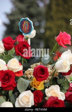 Bouquet of beautiful roses and flowers at Our Lady of Guadalupe Shrine in Des Plaines, Illinois, USA. Nuestra Senora de Guadalupe. Stock Photo