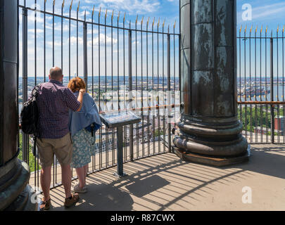 Couple looking at the view over the port from the tower of St Michael's Church (Hauptkirche Sankt Michaelis), Hamburg, Germany Stock Photo