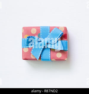 Dot pattern pink gift box isolated on white background Stock Photo