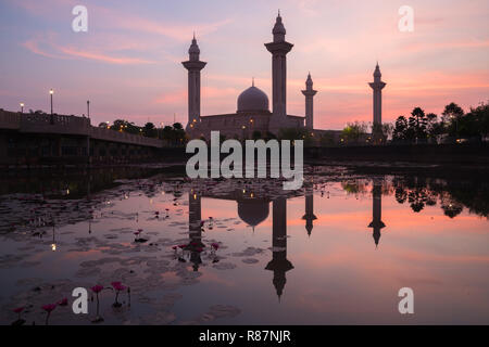 Morning sunrise sky of Masjid Bukit Jelutong in Shah Alam near Kuala lumpur, Malaysia. Also known as Mosque of Tengku Ampuan Rahimah. Stock Photo