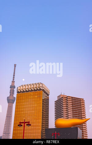 View of the Tokyo skyline from across the Sumida river in Asakusa including the Tokyo Skytree and the Asahi Beer Hall. Stock Photo