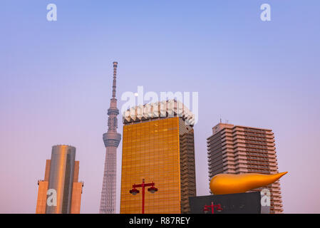 View of the Tokyo skyline from across the Sumida river in Asakusa including the Tokyo Skytree and the Asahi Beer Hall. Stock Photo