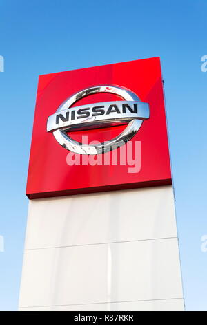 PRAGUE, CZECH REPUBLIC - DECEMBER 13 2018: Nissan motor company logo in front of dealership building on December 13, 2018 in Prague, Czech Republic. Stock Photo