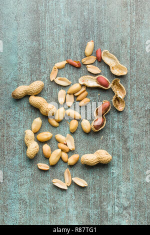 The dried peanuts. Groundnuts on old table. Top view. Stock Photo