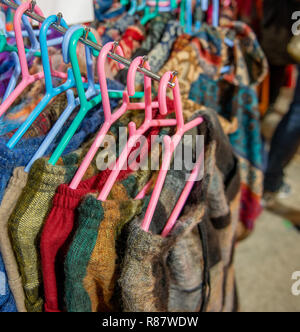 clothes hanging on colorful clothes hangers Stock Photo