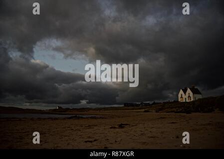 A beachfront victorian house at night in the seaside village of Rhosneigr, Anglesey, North Wales, UK Stock Photo