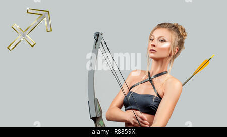 Sagittarius Zodiac Sign. Astrology and horoscope concept, beautiful woman with bow and arrow Stock Photo