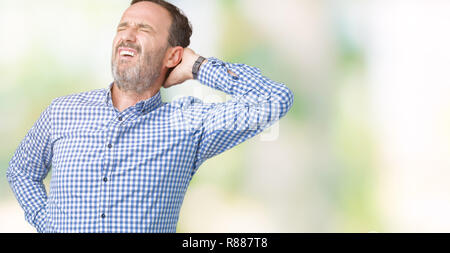 Handsome middle age elegant senior man over isolated background Suffering of neck ache injury, touching neck with hand, muscular pain Stock Photo