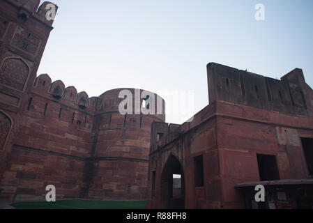 Splendor of mughal architecture of Agra Fort also called as the red fort with high thick strong walls made of red stones with arcs doors and windows Stock Photo