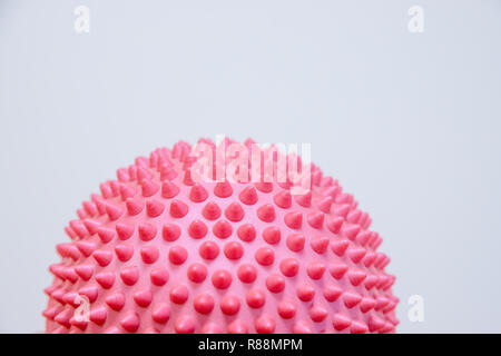 Spiky massage ball isolated on the white background.Flat feet correction exercise.half balance massage balls. rubber ball for self massage, reflexology and myofascial release.therapeutic exercise.Copy space Stock Photo