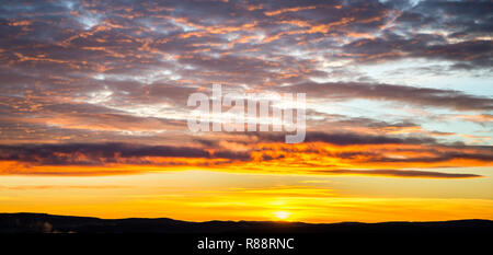 tragic sky, yellow-pink clouds, sunrise bright colors Stock Photo