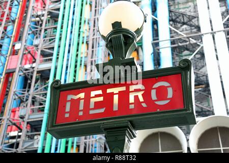Paris, France - August 19, 2018: Ancient Metro Signage and the Pompidou Center on background Stock Photo