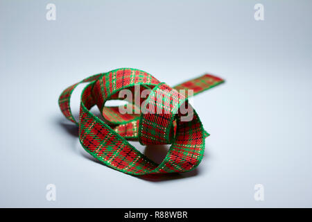 Macro abstract background of a crumpled green and red plaid Christmas ribbon Stock Photo
