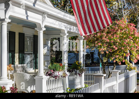 Charming home exterior with American flag, Woodstock, Vermont, USA. Stock Photo