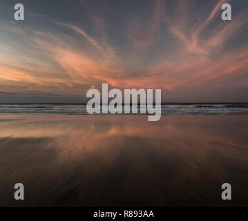 Sunset reflections in the wet sand Porthmeor beach St.ives Cornwaal UK Europe Stock Photo