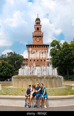 Vertical view of tourists outside the Castello Sforzesco and Torre del Filarete in Milan, Italy. Stock Photo