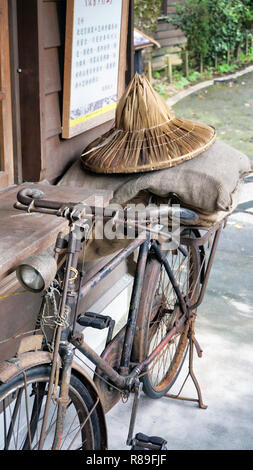 Old rusty delivery bicycle with rice sacks in Taiwan. Stock Photo