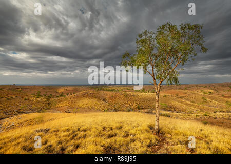 Tylers Pass and Tnorala (Gosse Bluff) under dark clouds. Stock Photo