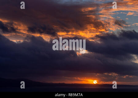 Sunset with clouds over the Irish Sea at Llandudno West Shore, North Wales Stock Photo