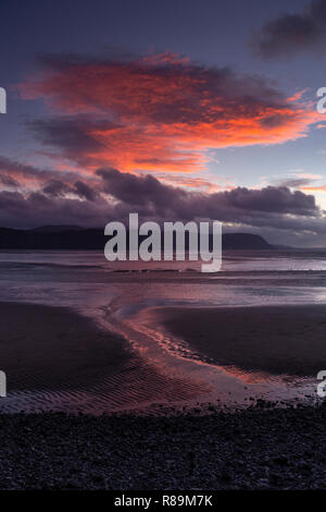 Sunlit clouds at sunset over the North Wales coast at Llandudno est Shore Stock Photo