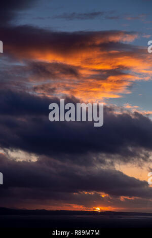 Sunset with clouds over the Irish Sea at Llandudno West Shore, North Wales Stock Photo