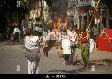 street performer, man jumping through fire ring, surajkund Fair, faridabad, haryana, india Stock Photo