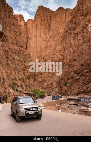 Morocco, Todra Gorge, tourist cars on road through deep gorge Stock Photo