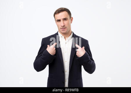 Handsome young caucasian man with upset questioning face pointing fingers at himself Stock Photo