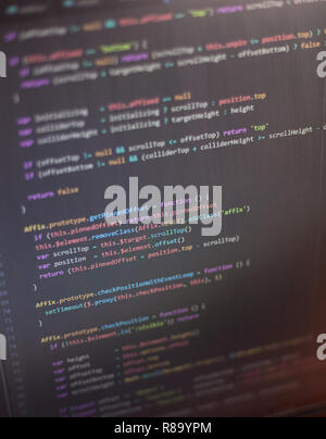 Colorful programming php and html source code on a monitor written by a young programmer. Stock Photo