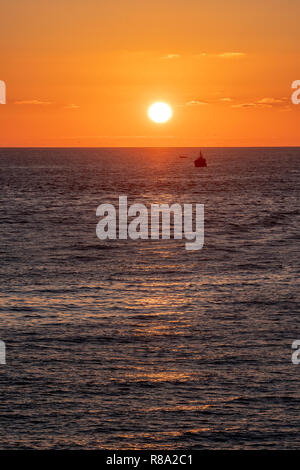 Sun Setting over the North Atlantic Ocean, Larache, Morocco Stock Photo