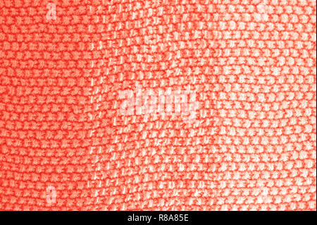 Knitted texture in Coral color. Close up. Stock Photo
