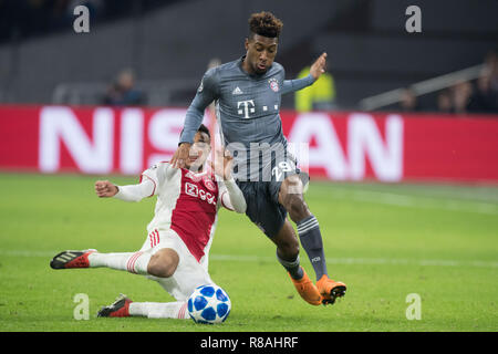 Amsterdam, Niederlande. 13th Dec, 2018. Noussair MAZRAOUI (left, Ajax) versus Kingsley COMAN (M), Action, duels, Soccer Champions League, Group stage, Group E, matchday 6, Ajax (Ajax) - FC Bayern Munich (M) 3: 3, 12.12. 2018 in Amsterdam/Netherlands. | Usage worldwide Credit: dpa/Alamy Live News Stock Photo