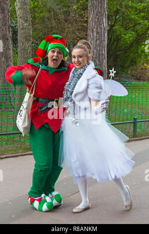 Bournemouth, Dorset, UK. 14th December 2018. White Fairy and Elf up to mischief in Bournemouth Gardens on a bitterly cold overcast day. Credit: Carolyn Jenkins/Alamy Live News Stock Photo