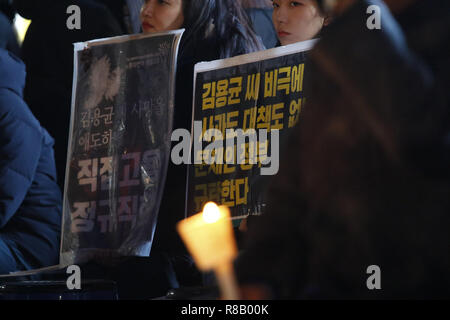 December 15, 2018 - Seoul, SOUTH KOREA - Dec 15, 2018-Seoul, South Korea-A Hundred People attend with hold candle light, memorial ceremony about a died temporary position worker Kim's at Gwanghwamoon Square in Seoul, South korea. Last tuesday after getting stuck on a coal conveyor belt at the Taean Thermal Power Plant operated by Korea Western Power (KOWEPO) in South ChungcheongProvince. The 24-year-old worker named Kim Yong-gyun had been at his job only three months after a long search for work. He was hired by Korea Engineering and Power Services, a subcontractor of the power plant that oper Stock Photo