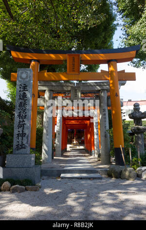 Fukuoka, Japan-October 19, 2018: Entrance with red torii to a shrine at the Kushida ninja shrine grounds