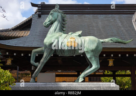Fukuoka, Japan-October 19, 2018: Brass statue of sacred horse at the Kushida ninja shrine grounds