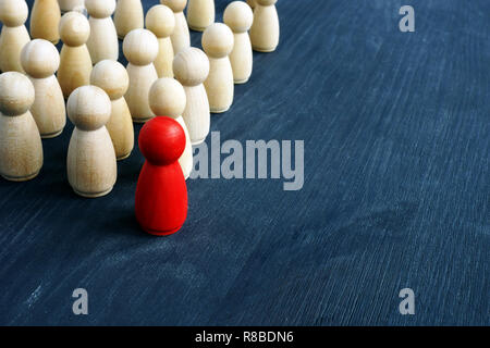 Leadership and management in business. Small figures on the desk. Stock Photo