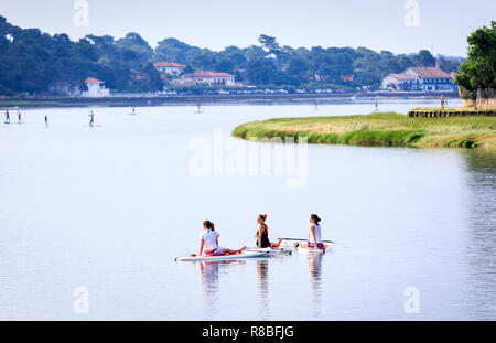 Stand Up Paddle Yoga, Hossegor Lake, France Stock Photo