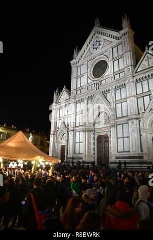Florence, ITALY - DECEMBER 2018: Christmas Market in front of the 'Basilica of Santa Croce'. Xmas atmosphere, Italy. Stock Photo