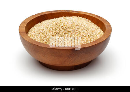 Amaranth seeds in wooden bowl isolated on white background Stock Photo