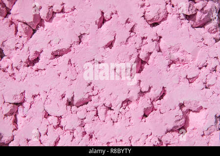 Light pink color powder background. Bright colours for Indian holi festival. Colorful gulal, cosmetic powder. Selective focus, copy space Stock Photo
